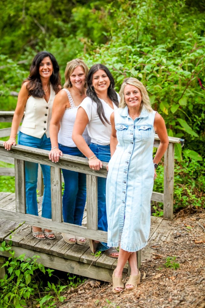Photo of Andrea deStefano Team of Sibcy Cline Realtors on a bridge.