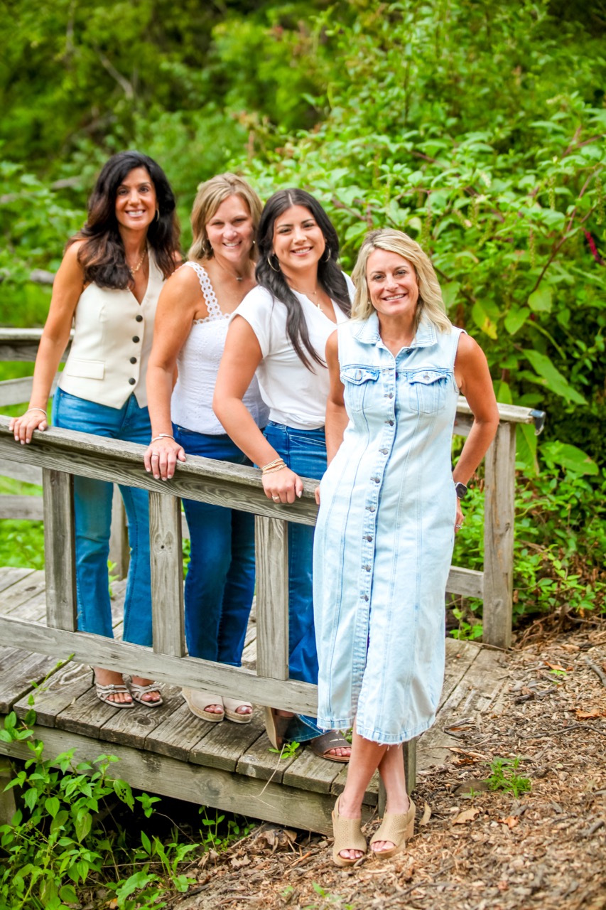 Photo of Andrea deStefano Team of Sibcy Cline Realtors on a bridge.